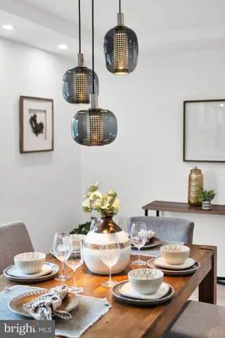 a kitchen with a table and chairs