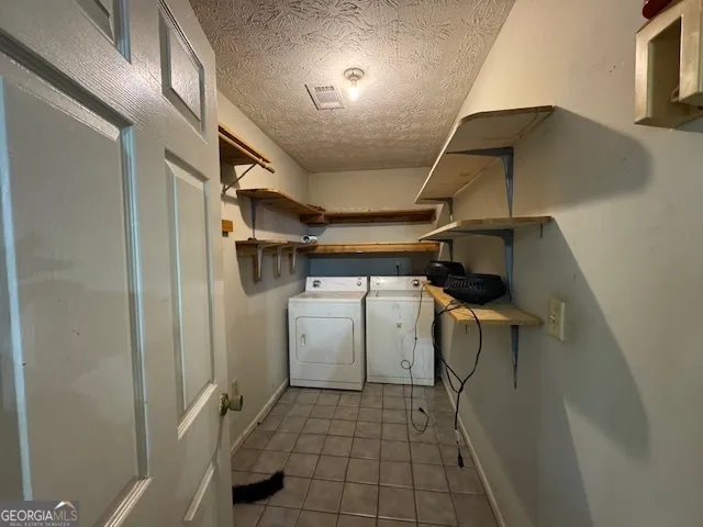 a view of storage and utility room with racks on the wall