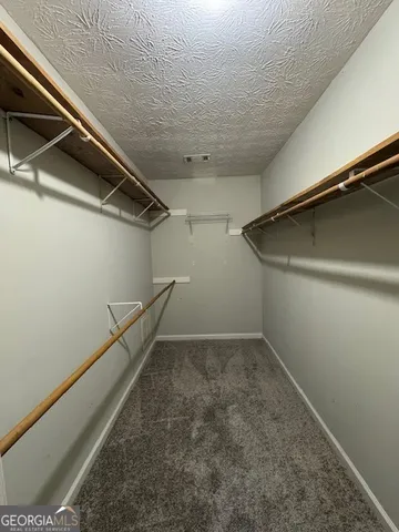 a view of a room with racks on the wall