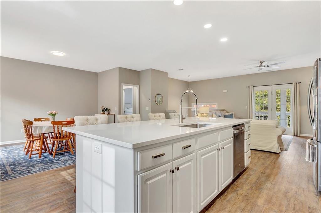 68 Skyview Road Senoia, GA 30276 - Photo 11 of 51 a kitchen with a sink and chairs