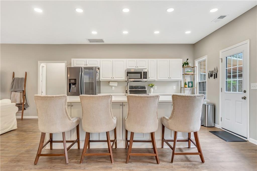 68 Skyview Road Senoia, GA 30276 - Photo 14 of 51 a view of kitchen with stainless steel appliances cabinets table and chairs
