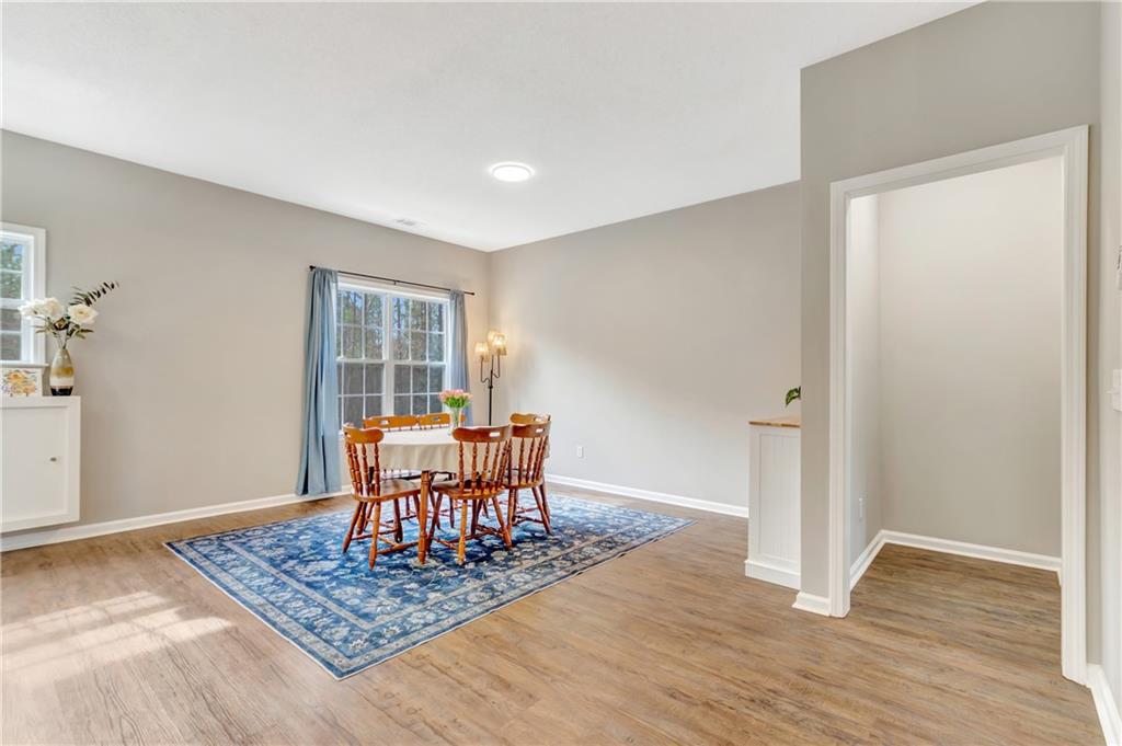 68 Skyview Road Senoia, GA 30276 - Photo 15 of 51 a dining room with wooden floor and a rug