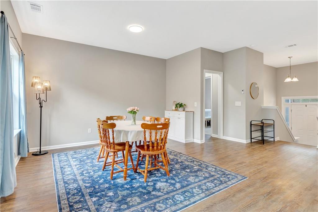 68 Skyview Road Senoia, GA 30276 - Photo 17 of 51 a view of a dining room with furniture and wooden floor