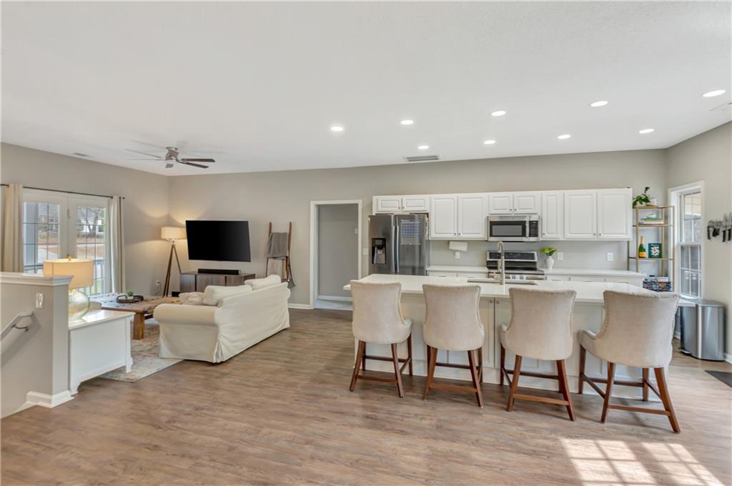 68 Skyview Road Senoia, GA 30276 - Photo 18 of 51 a living room with stainless steel appliances furniture and a flat screen tv