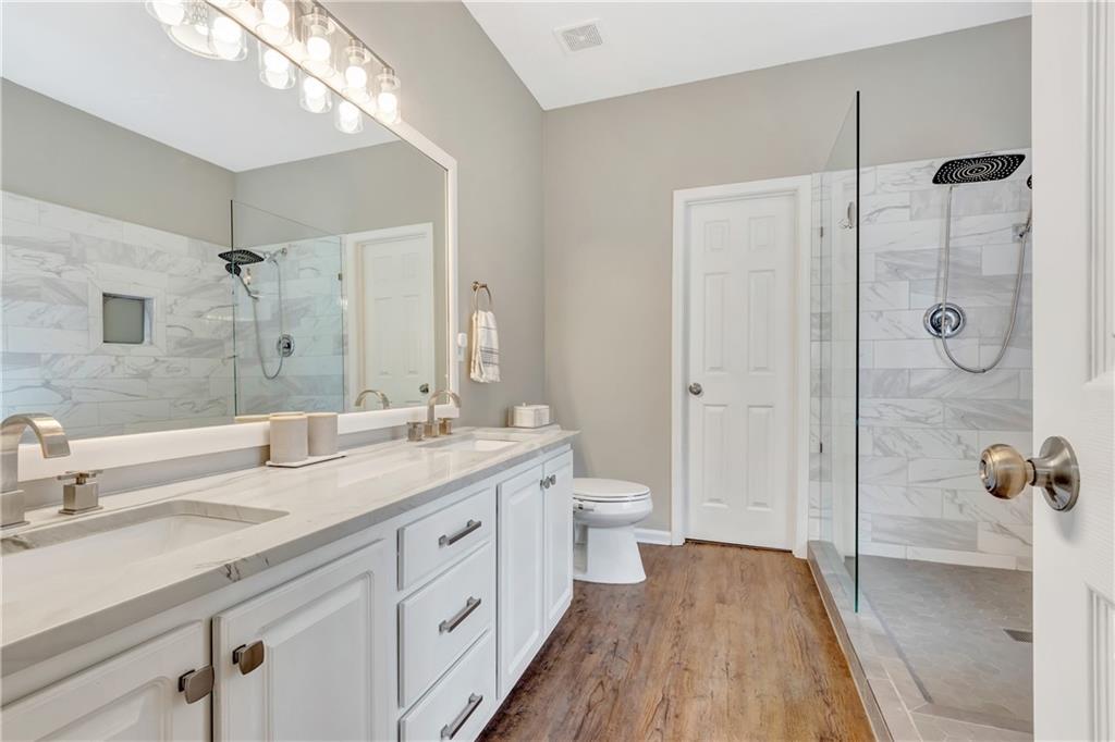 68 Skyview Road Senoia, GA 30276 - Photo 21 of 51 a spacious bathroom with a granite countertop sink mirror and toilet