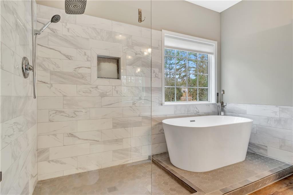 68 Skyview Road Senoia, GA 30276 - Photo 23 of 51 a bathroom with a bathtub and window