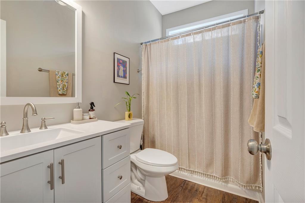 68 Skyview Road Senoia, GA 30276 - Photo 27 of 51 a bathroom with a toilet a sink and a mirror