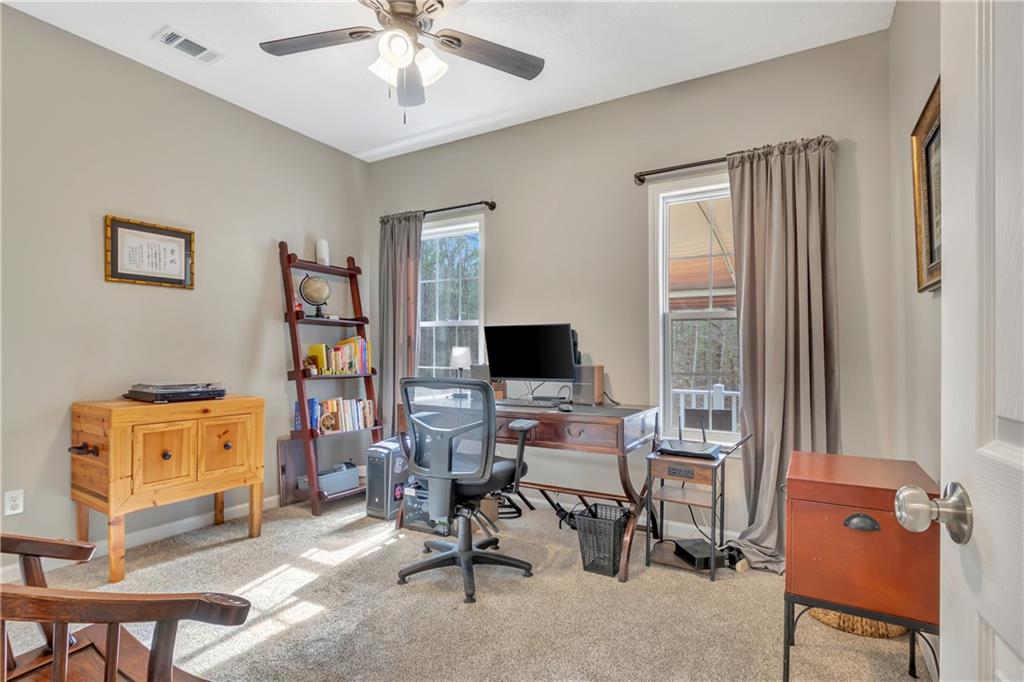 68 Skyview Road Senoia, GA 30276 - Photo 28 of 51 a view of a workspace with furniture and a window
