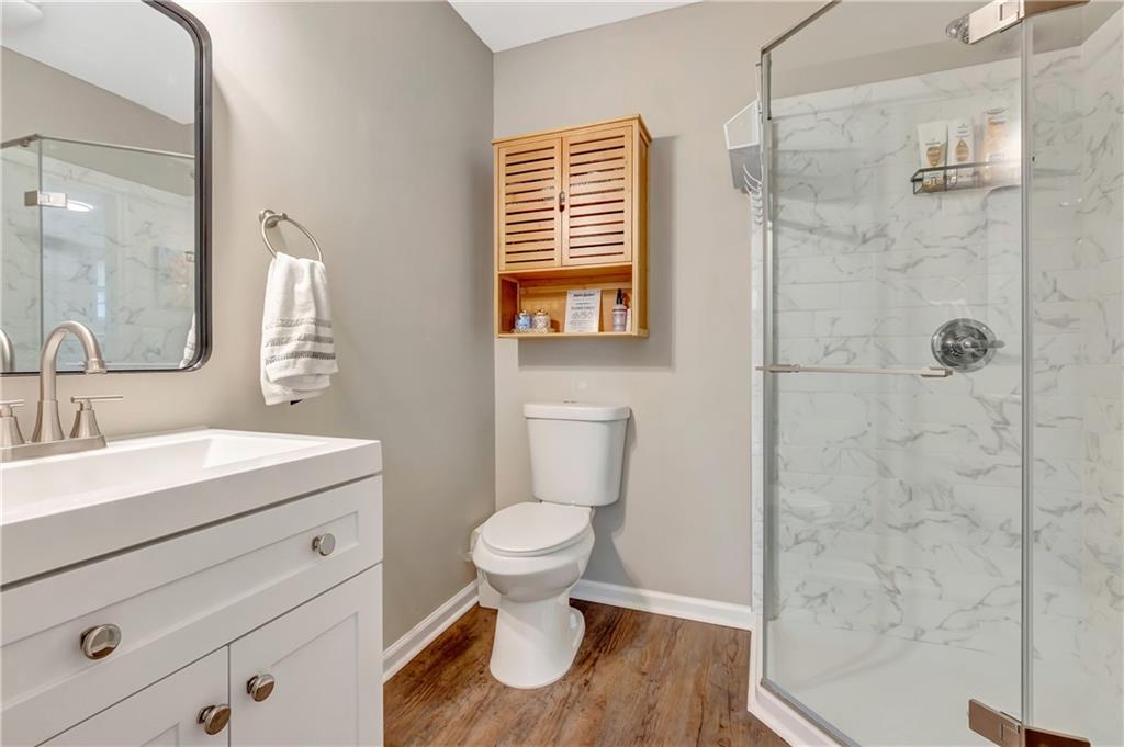 68 Skyview Road Senoia, GA 30276 - Photo 34 of 51 a bathroom with a toilet sink and a shower