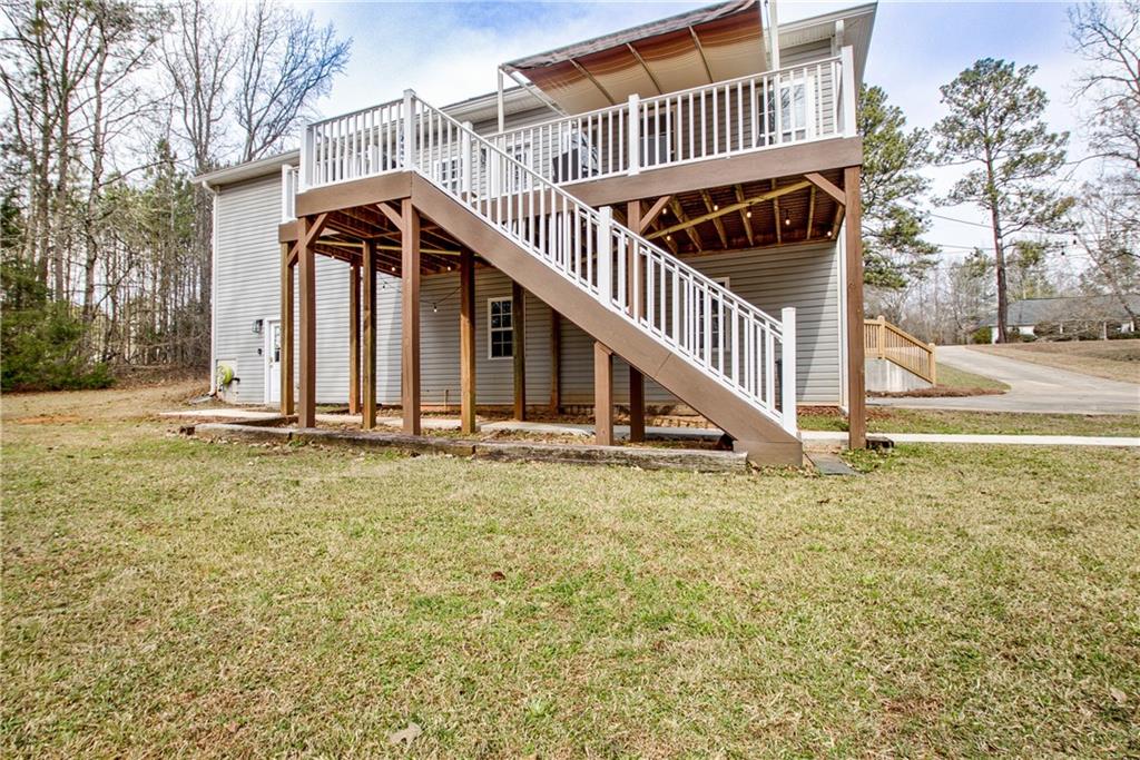 68 Skyview Road Senoia, GA 30276 - Photo 44 of 51 a view of a house with backyard and deck