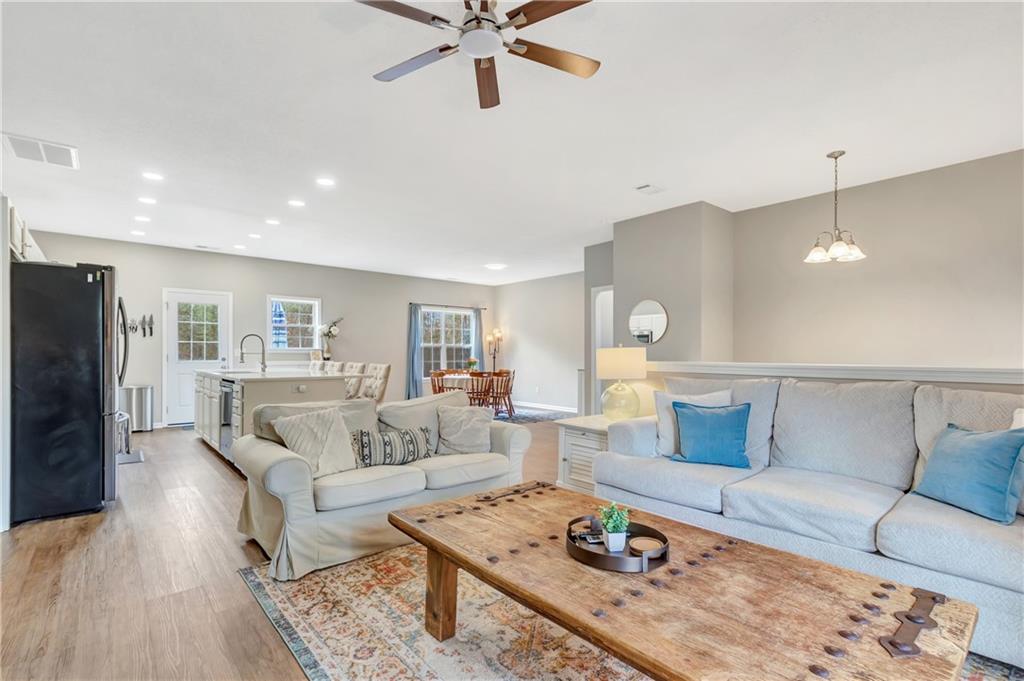 68 Skyview Road Senoia, GA 30276 - Photo 9 of 51 a living room with furniture and wooden floor
