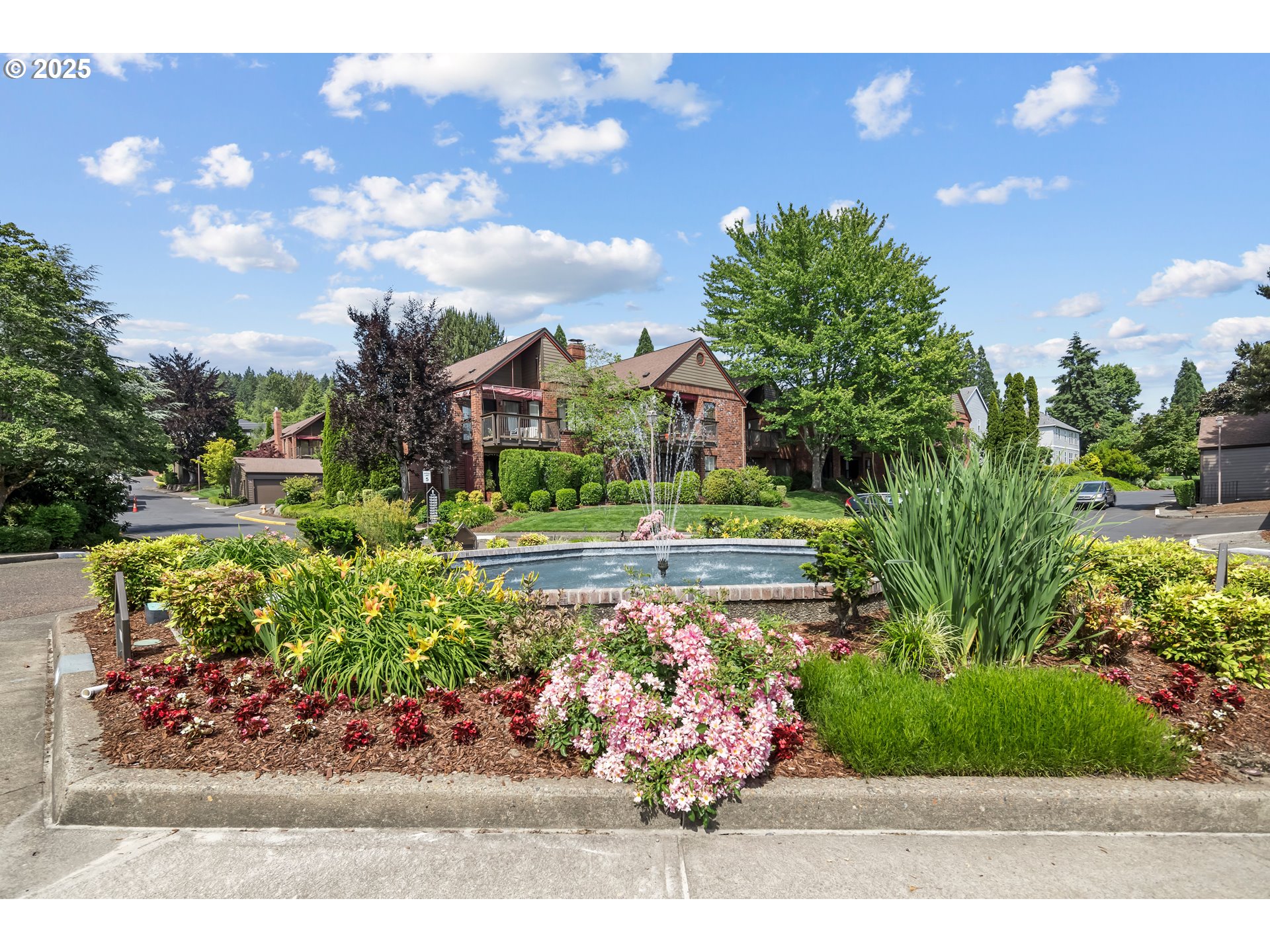15565 Southwest 114th Court, Unit 26 Portland, OR 97224 - Photo 25 of 32 a front view of a house with a yard