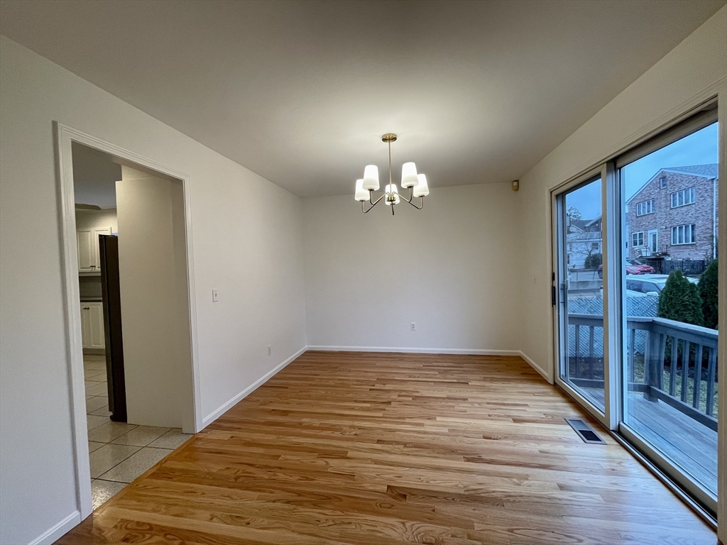 196 Linwood Avenue, Unit 196 Newton, MA 02460 - Photo 14 of 37 a view of empty room with wooden floor