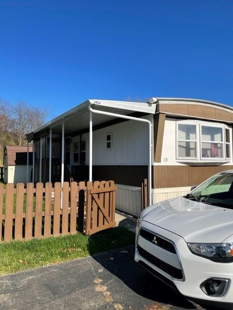 23 Reedsdale Drive Clairton, PA 15025 - Photo 2 of 17 a front view of a house with a garden