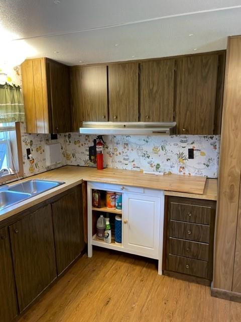 23 Reedsdale Drive Clairton, PA 15025 - Photo 4 of 17 a kitchen with a sink and cabinets