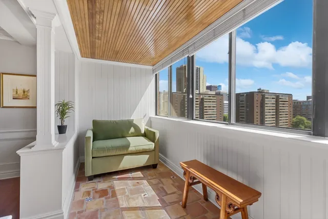 a living room with furniture and a window