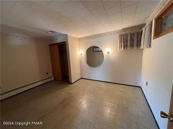 2324 Lake Minsi Drive Bangor, PA 18013 - Photo 16 of 20 an empty room with wooden floor and mirror