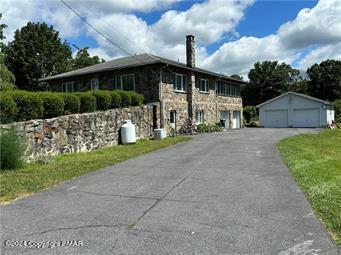2324 Lake Minsi Drive Bangor, PA 18013 - Photo 6 of 20 a front view of a house with garden