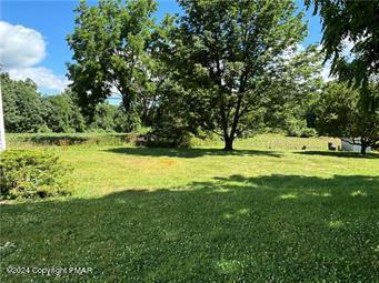 2324 Lake Minsi Drive Bangor, PA 18013 - Photo 9 of 20 a view of yard with swimming pool and green space