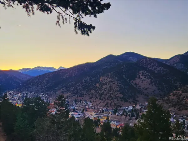 a kitchen with granite countertop a sink stove and cabinets