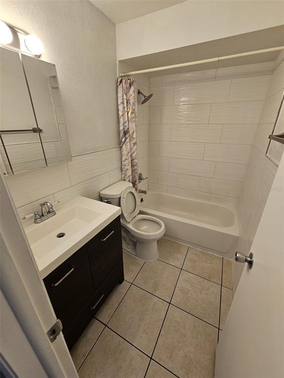 10481 Riva Ridge Trail Orlando, FL 32817 - Photo 8 of 9 a bathroom with a sink a toilet and shower