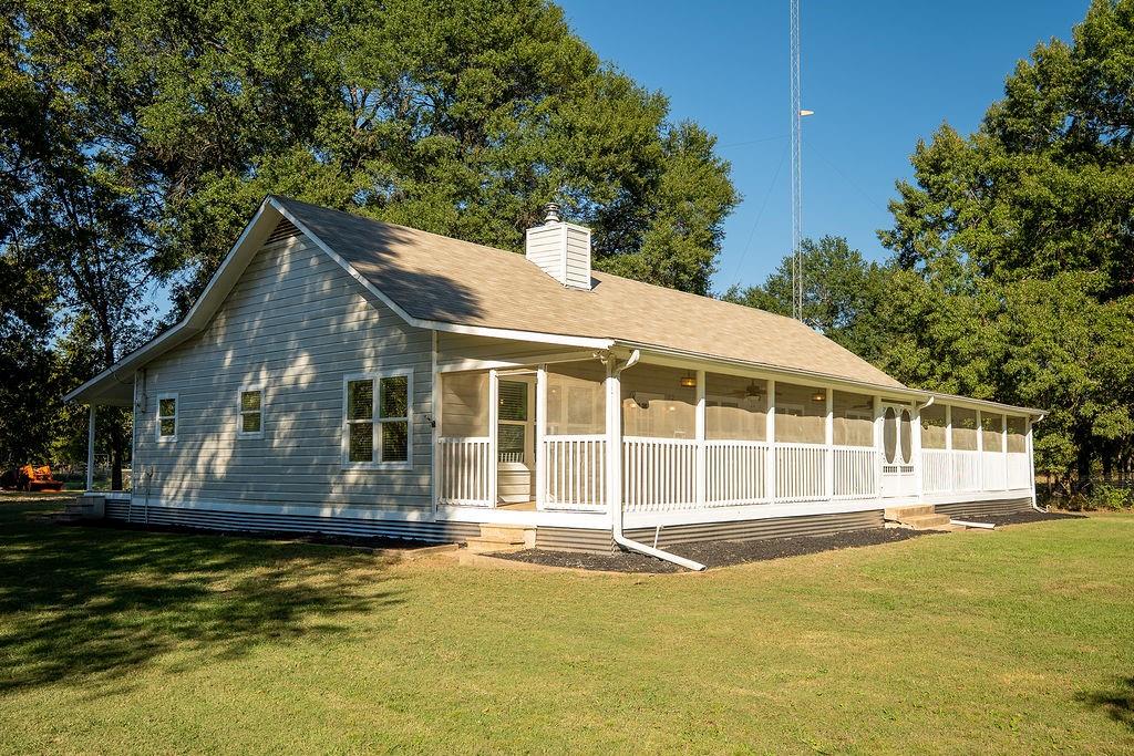213 County Road 2320 Telephone, TX 75488 - Photo 14 of 40 a house view with a garden space