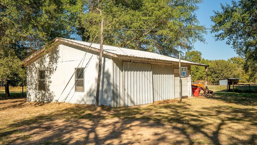 213 County Road 2320 Telephone, TX 75488 - Photo 17 of 40 Workshop with attached garage