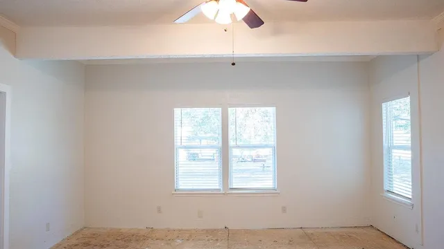 a view of an empty room with a window