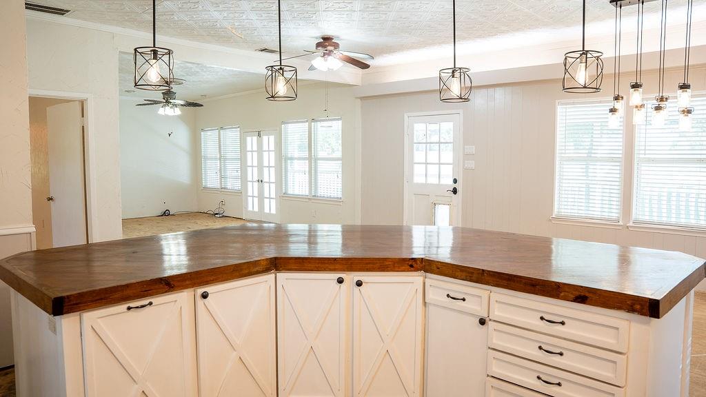 213 County Road 2320 Telephone, TX 75488 - Photo 9 of 40 a view of a kitchen with a sink and window