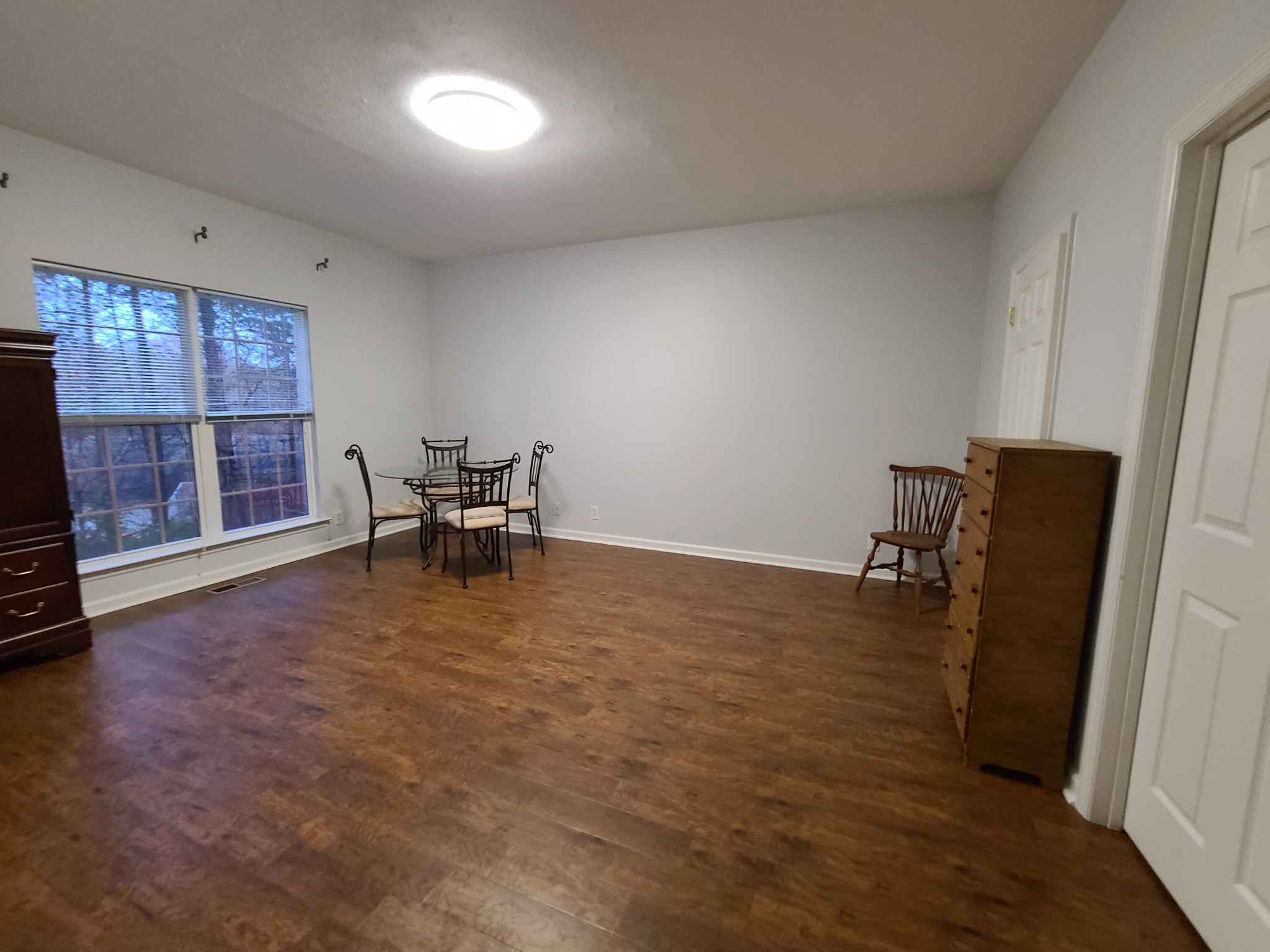 728 Canoe Ridge Point Antioch, TN 37013 - Photo 29 of 40 wooden floor in an empty room with a window