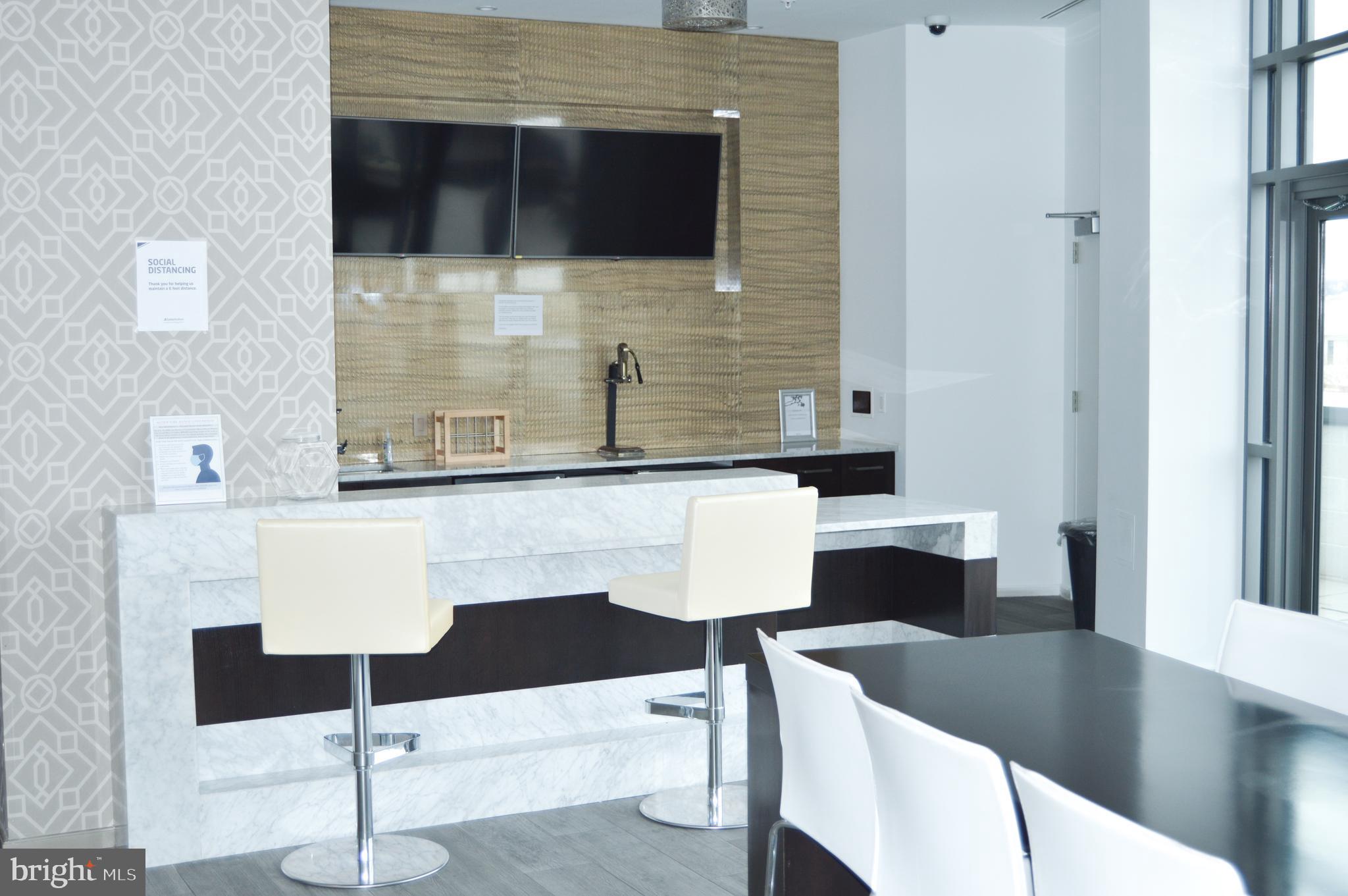 460 New York Avenue Northwest, Unit 805 Washington, DC 20001 - Photo 17 of 21 a living room with couches chairs and fireplace