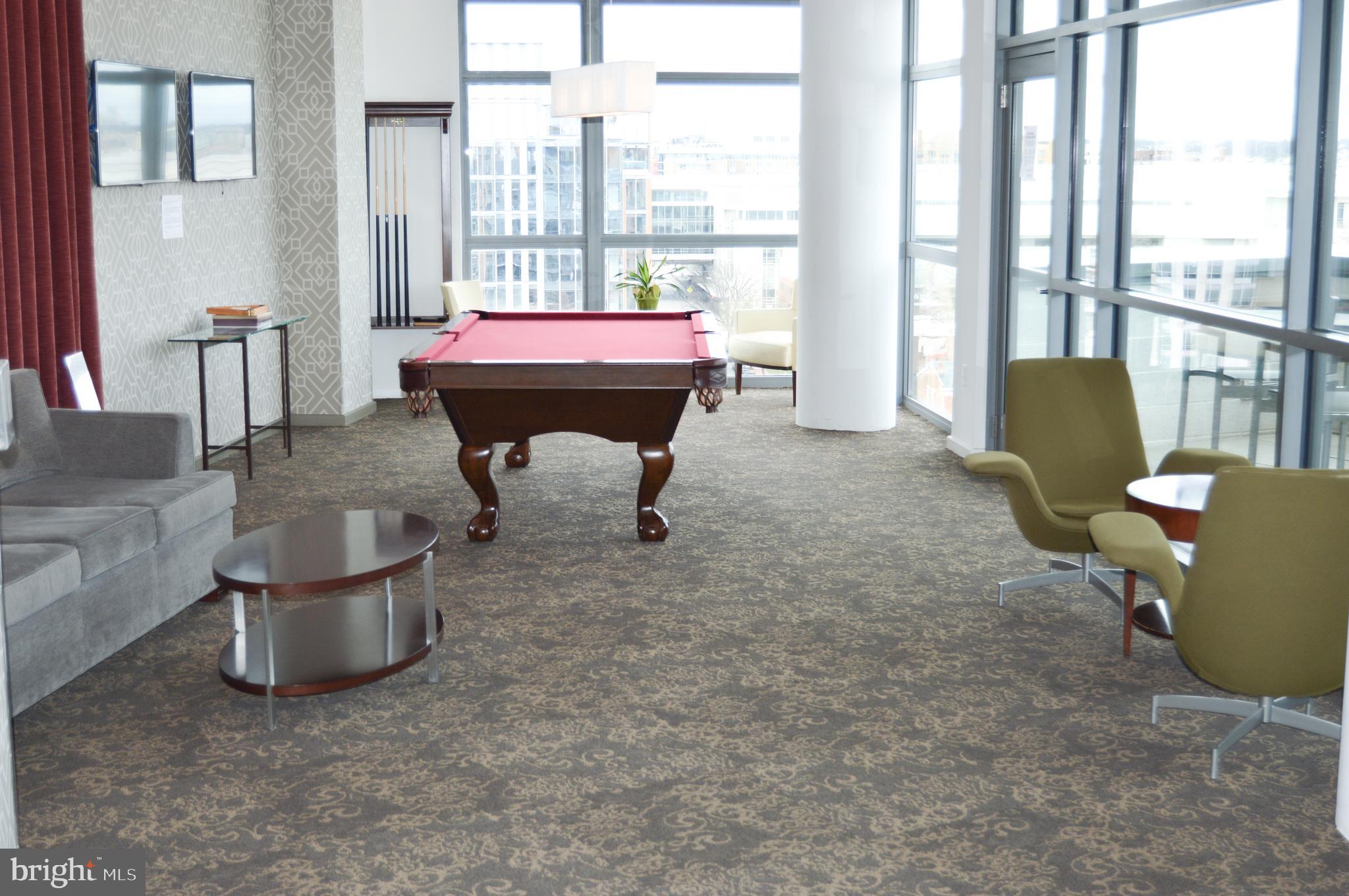 460 New York Avenue Northwest, Unit 805 Washington, DC 20001 - Photo 18 of 21 a living room with furniture and a floor to ceiling window