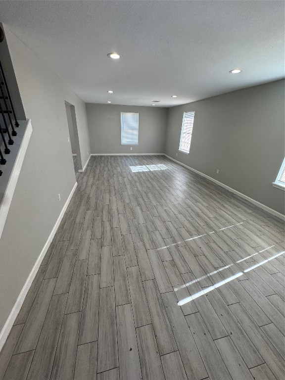 8502 North Main Street Houston, TX 77022 - Photo 4 of 13 a view of empty room with wooden floor