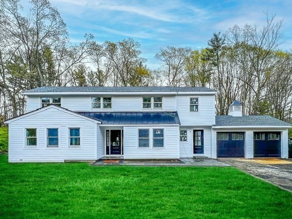 15 Highgate Road Wayland, MA 01778 - Photo 1 of 12 front view of a house and a yard