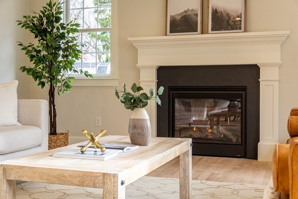 15 Highgate Road Wayland, MA 01778 - Photo 8 of 12 a living room with furniture and a fireplace