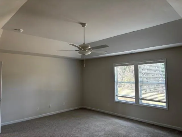 an empty room with a empty space and a window