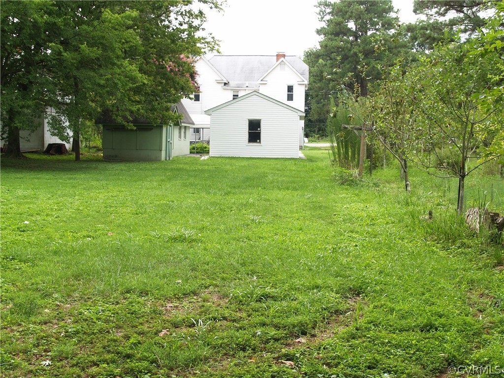 7988 Richmond Road Toano, VA 23168 - Photo 8 of 25 Large rear yard behind garage & workshop.