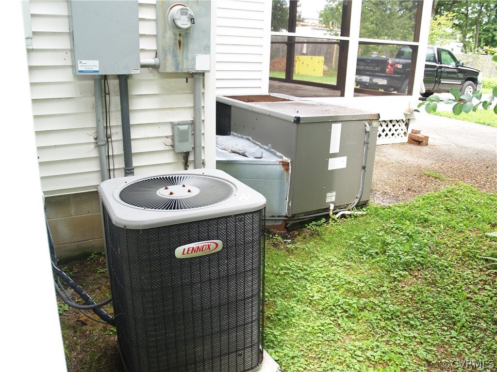7988 Richmond Road Toano, VA 23168 - Photo 10 of 25 1st level HVAC unit & 2nd level AC compressor.