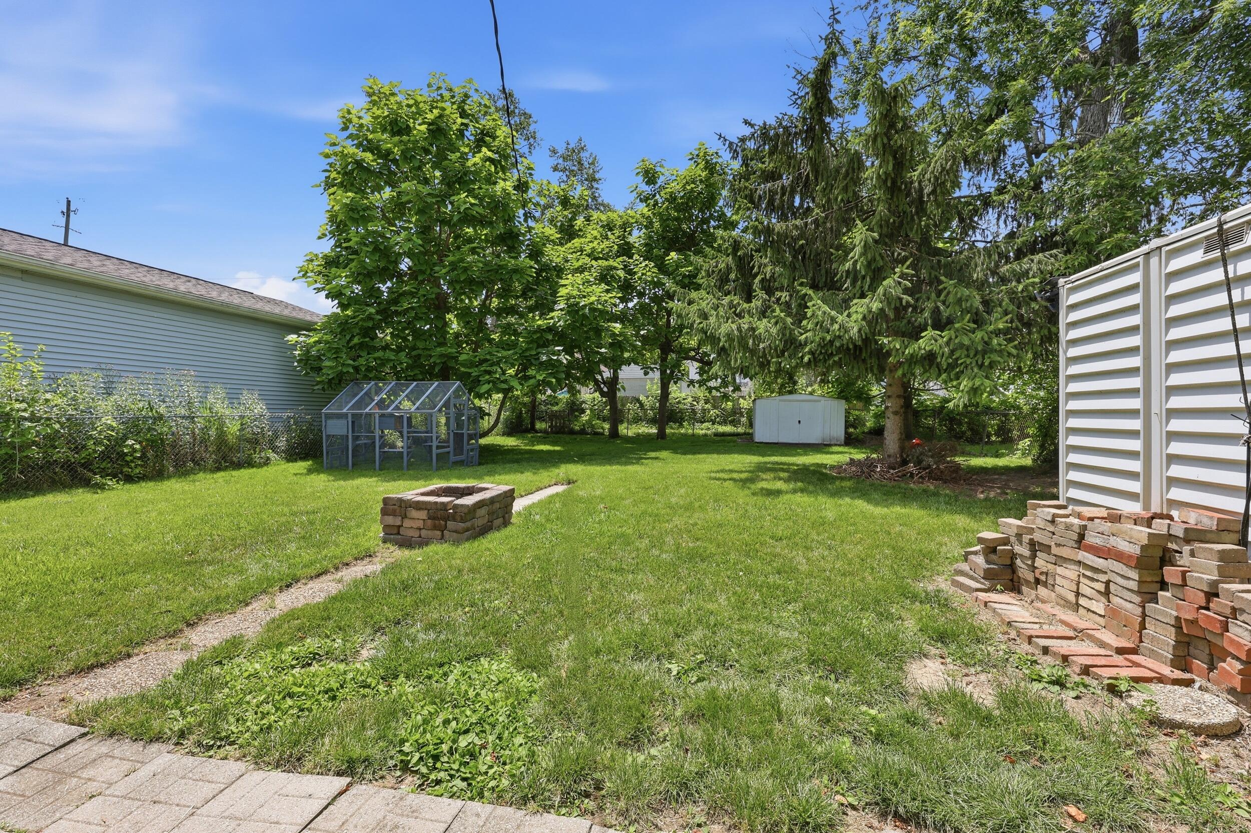 2201 Ferris Road Columbus, OH 43224 - Photo 17 of 25 Fire pit and 2 sheds
