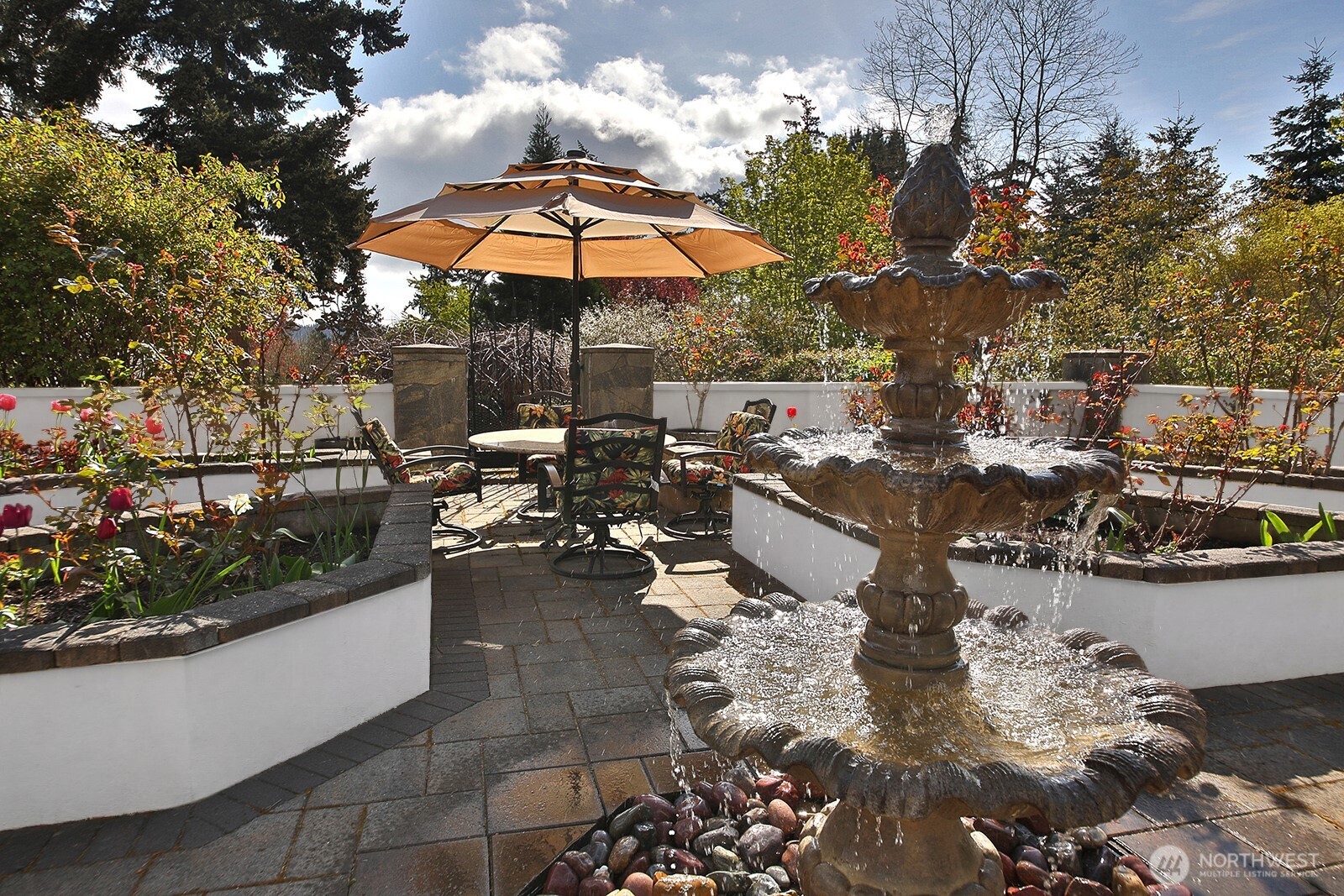 5741 Crow Haven Road Langley, WA 98260 - Photo 12 of 40 a view of a patio with chairs and umbrellas on a sidewalk