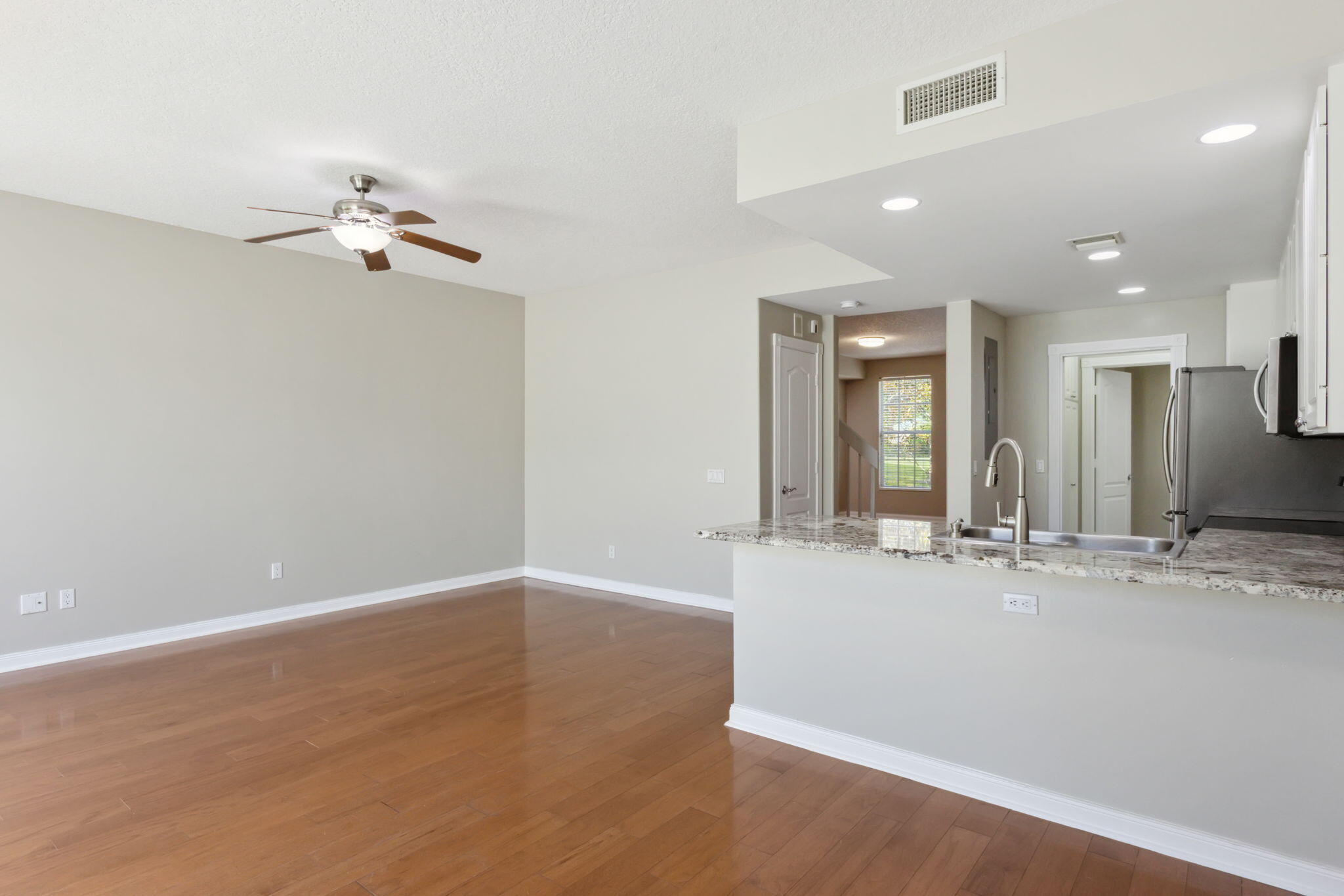 155 Waterford Drive Jupiter, FL 33458 - Photo 11 of 51 wooden floor in an empty room with a window