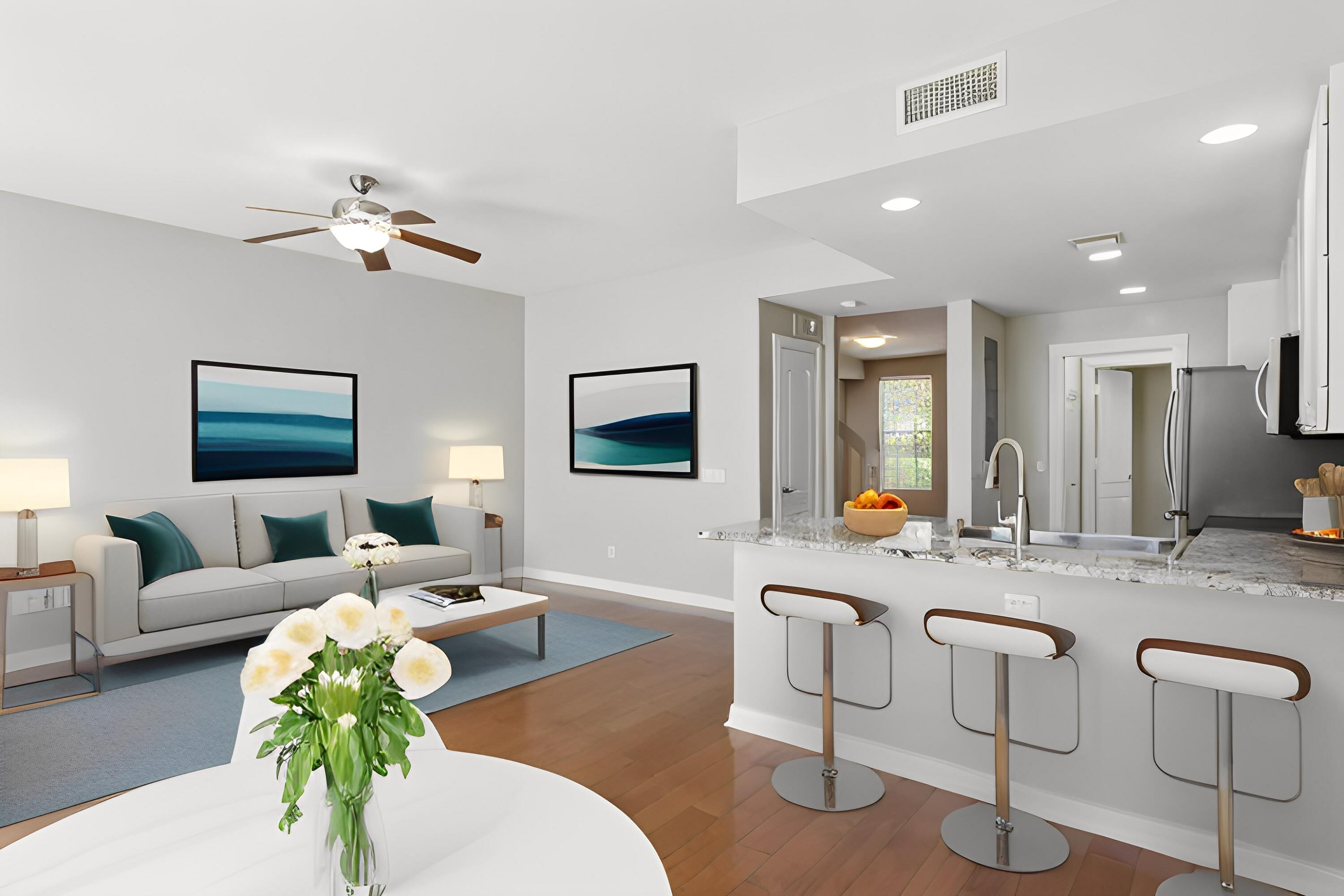 155 Waterford Drive Jupiter, FL 33458 - Photo 12 of 51 a living room with furniture potted plant and a chandelier