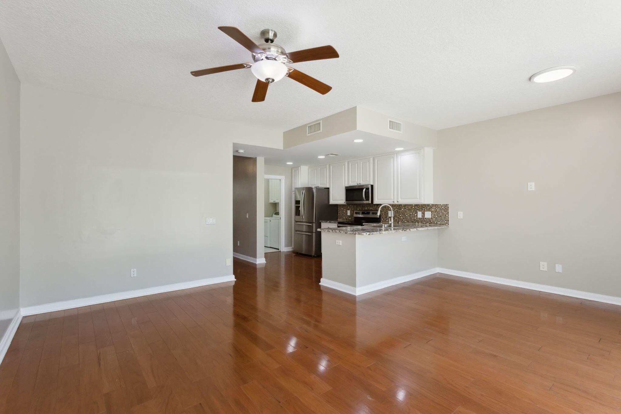 155 Waterford Drive Jupiter, FL 33458 - Photo 13 of 51 a view of kitchen with sink microwave and refrigerator