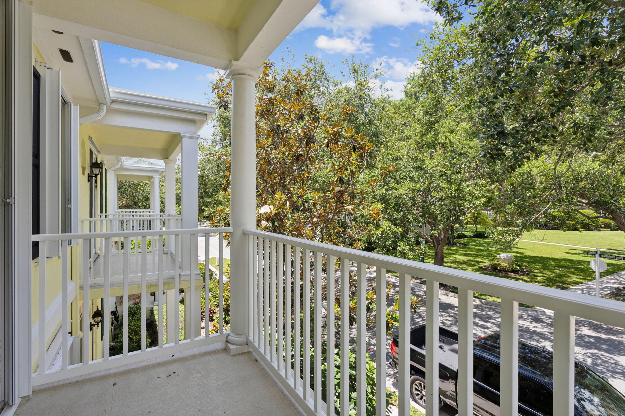 155 Waterford Drive Jupiter, FL 33458 - Photo 30 of 51 a view of a balcony with wooden floor