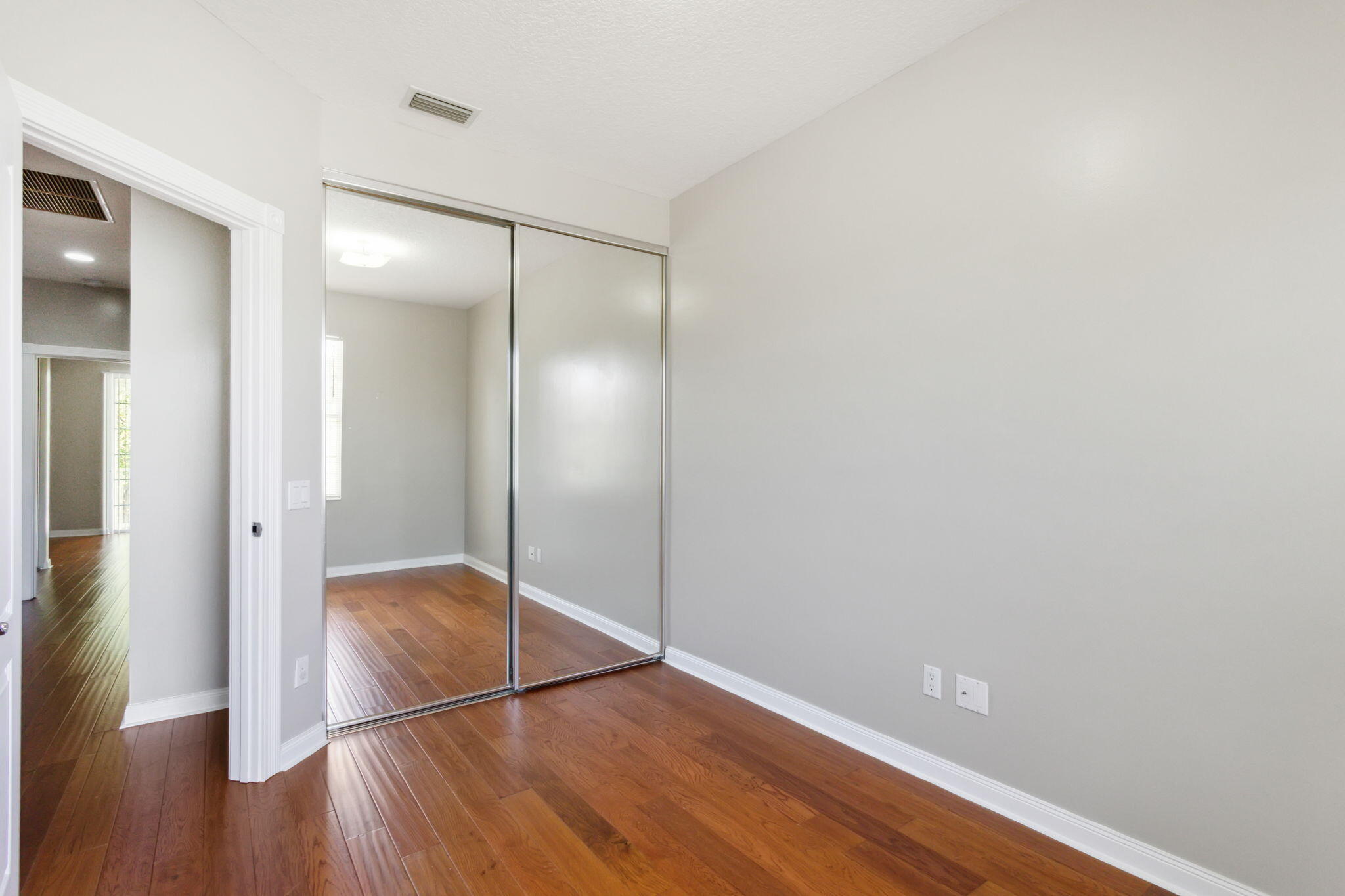 155 Waterford Drive Jupiter, FL 33458 - Photo 31 of 51 a view of empty room with wooden floor
