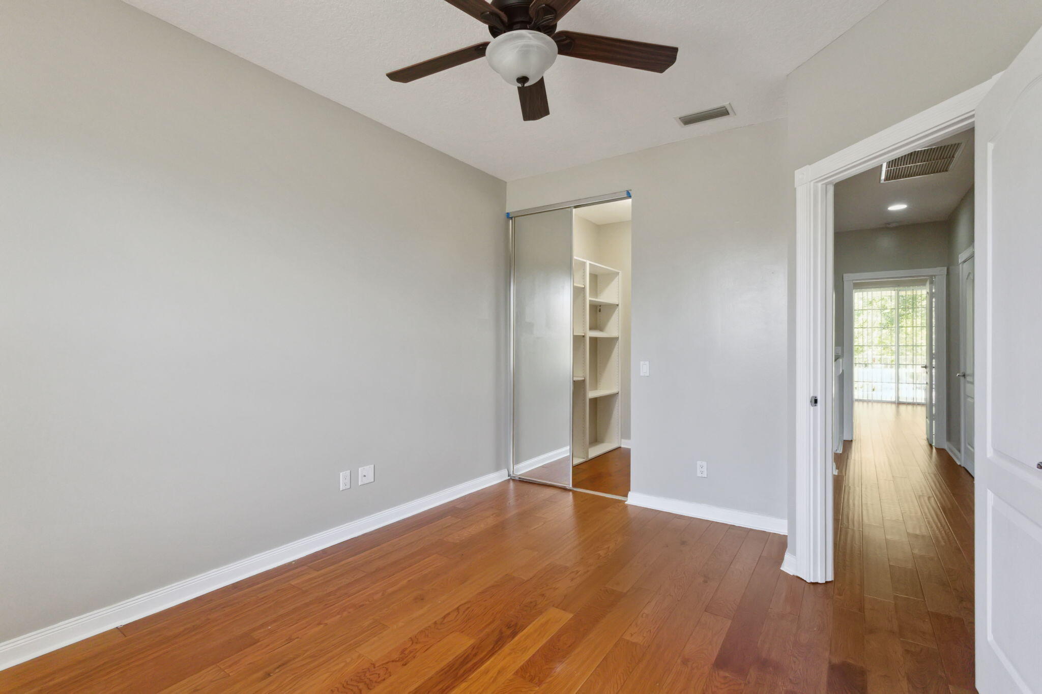 155 Waterford Drive Jupiter, FL 33458 - Photo 33 of 51 wooden floor in an empty room with a window
