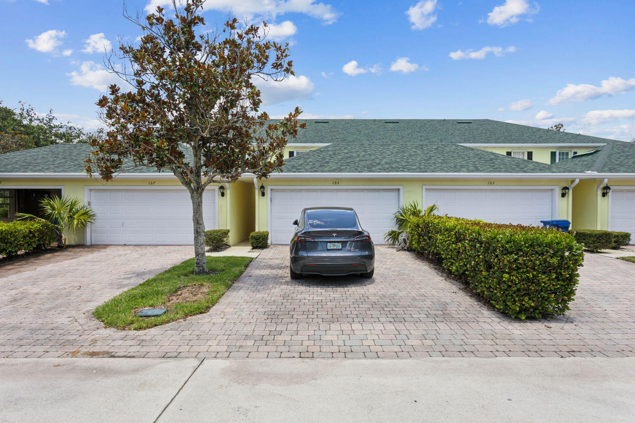 155 Waterford Drive Jupiter, FL 33458 - Photo 42 of 51 a car parked in front of a building