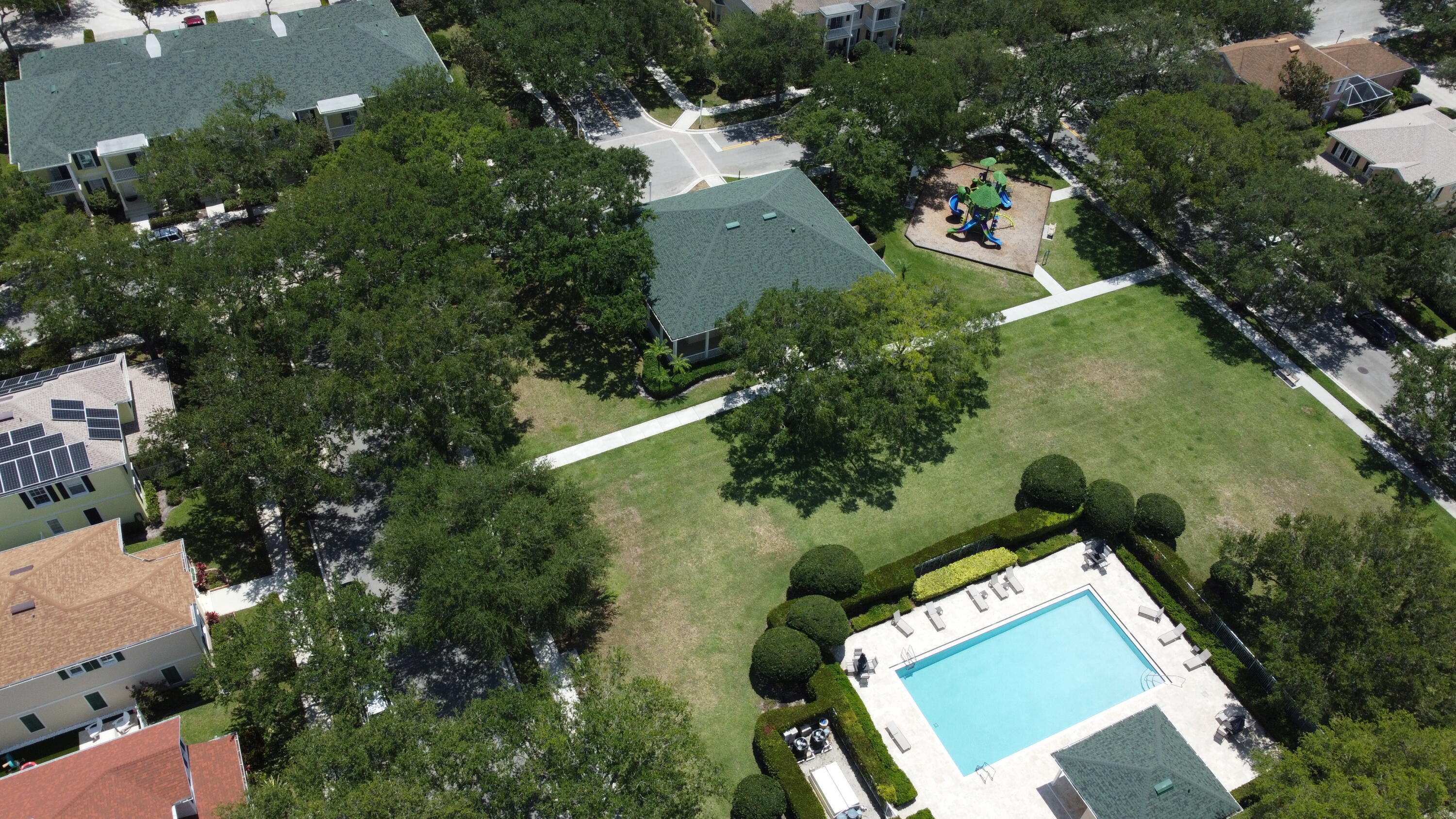 155 Waterford Drive Jupiter, FL 33458 - Photo 43 of 51 an aerial view of a house with a yard and trees all around