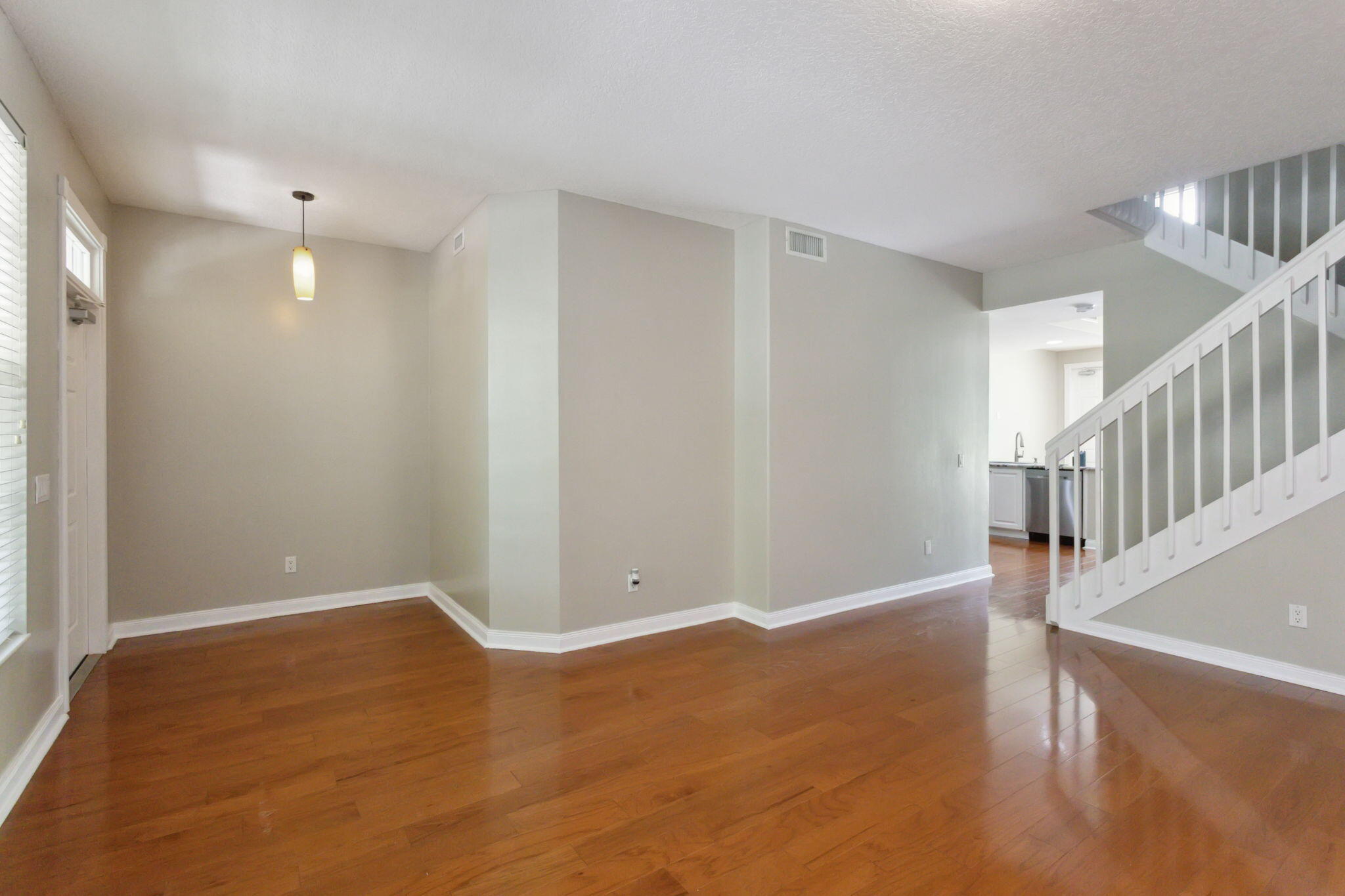 155 Waterford Drive Jupiter, FL 33458 - Photo 9 of 51 a view of an empty room with wooden floor