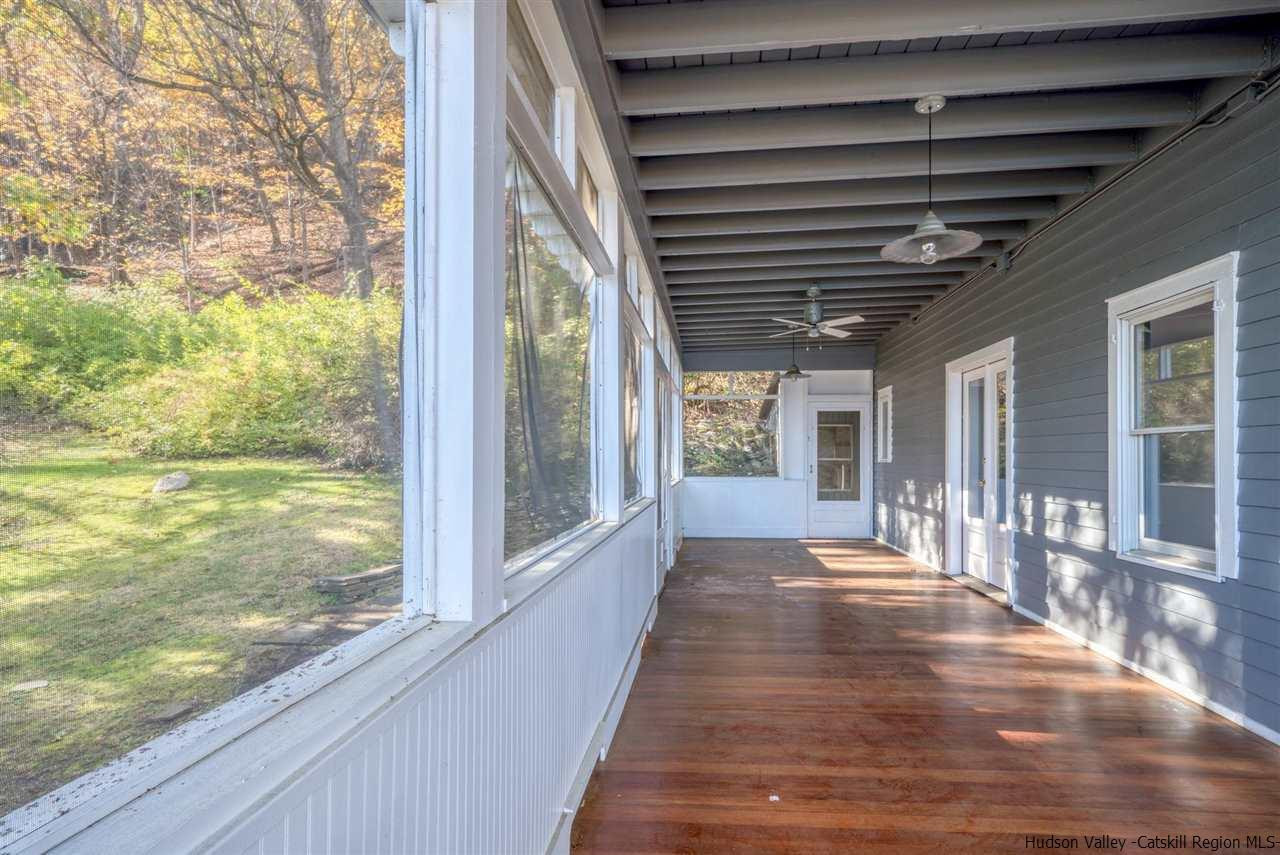 94 River Road Ulster Park, NY 12487 - Photo 13 of 31 a front view of a house with a porch